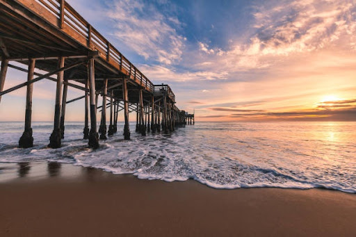 Newport Beach Pier Sunset - Luxury Property Management